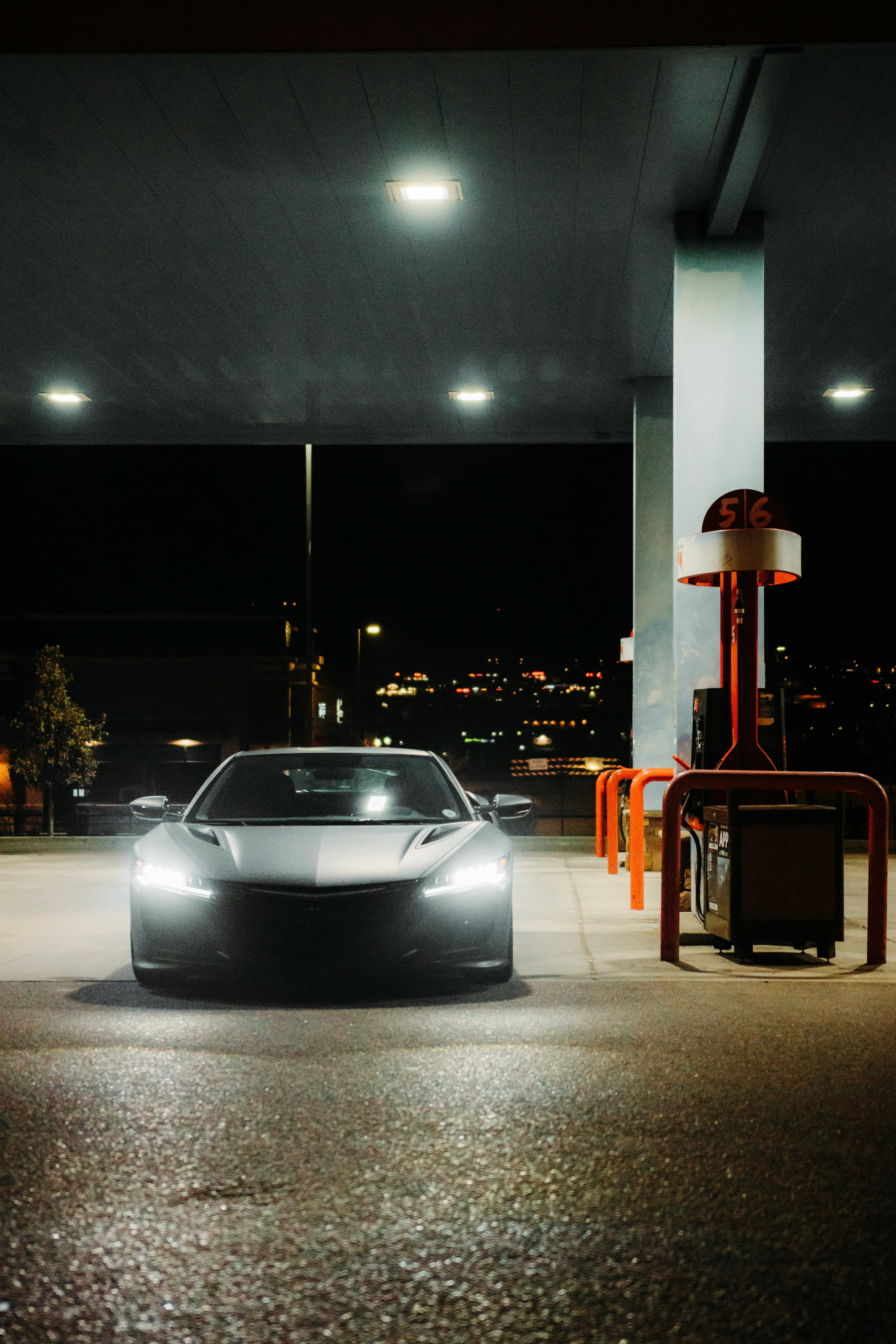 white porsche 911 parked on parking lot during night time